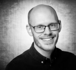 Victor Svensson in front of a gray background.